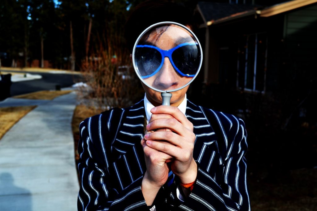 person holding magnifier