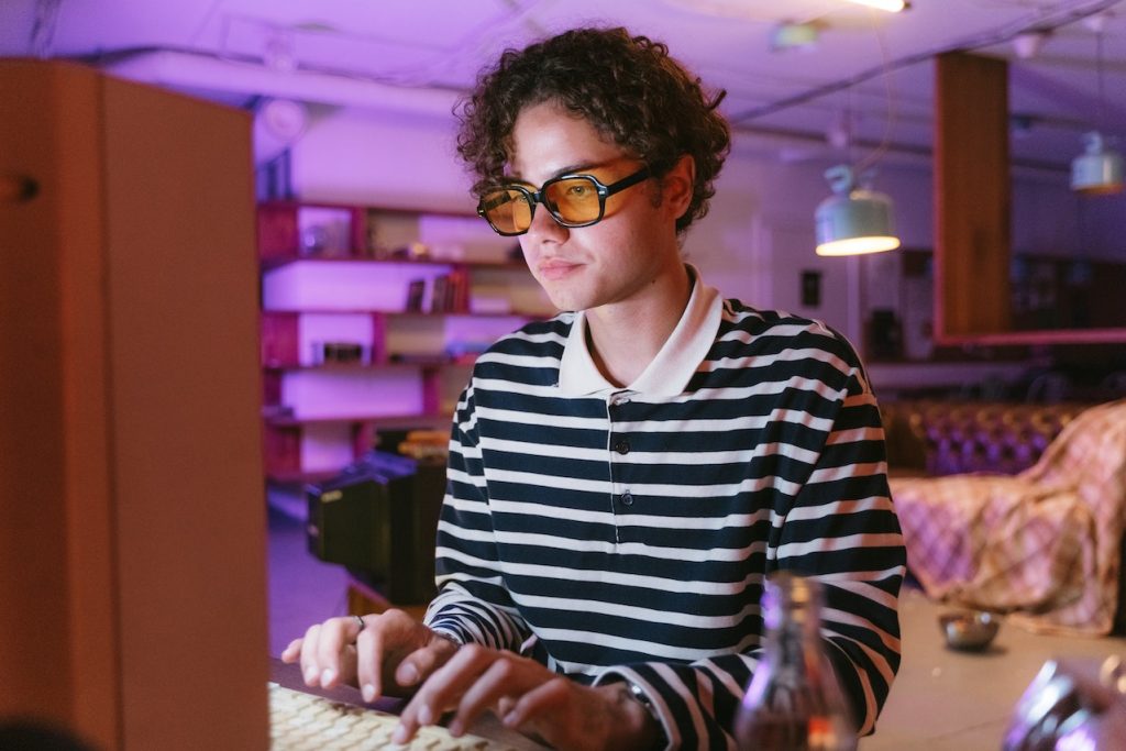 Person wearing goggles using quantum computer